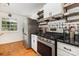 The kitchen showcases modern stainless-steel appliances, granite countertops and white cabinets at 7015 Lavern St, Charlotte, NC 28215