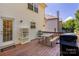 Back deck features outdoor dining area, grill, and access to the home's interior at 8619 New Oak Ln, Huntersville, NC 28078