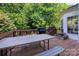 Outdoor deck features a grill, dining table, and seating, perfect for outdoor entertaining at 8619 New Oak Ln, Huntersville, NC 28078
