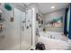 Relaxing bathroom featuring a separate shower and tub alongside beach themed decor at 8619 New Oak Ln, Huntersville, NC 28078