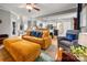 Open-concept living room connected to the kitchen, featuring hardwood floors at 8619 New Oak Ln, Huntersville, NC 28078