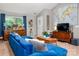 Inviting living room with a plush blue sectional sofa, media center, and neutral-toned decor at 8619 New Oak Ln, Huntersville, NC 28078