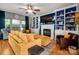 Comfortable living room featuring built-in shelving, a fireplace, and stylish decor at 8619 New Oak Ln, Huntersville, NC 28078