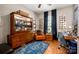 Home office with hardwood floors, a vintage cabinet, and a comfortable workspace at 8619 New Oak Ln, Huntersville, NC 28078