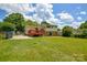 Spacious backyard with green lawn and a wooden deck at 923 Yuma St, Charlotte, NC 28213