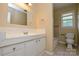 A bathroom with a single sink vanity, a large mirror, and a tub/shower combo at 923 Yuma St, Charlotte, NC 28213