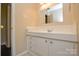 Bathroom with a single sink, neutral paint, and a large mirror at 923 Yuma St, Charlotte, NC 28213