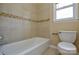 Bathroom with a tiled shower and a toilet in a remodeled space at 923 Yuma St, Charlotte, NC 28213