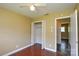 The bedroom has neutral paint, hardwood floors, a closet, and a ceiling fan at 923 Yuma St, Charlotte, NC 28213