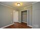 This is a bedroom with a wood floor, a closet, and neutral colored walls at 923 Yuma St, Charlotte, NC 28213
