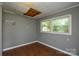 A bedroom featuring wood floors and a window to let in natural light at 923 Yuma St, Charlotte, NC 28213
