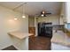 Well-lit kitchen with bar-style seating, and stainless steel appliances at 923 Yuma St, Charlotte, NC 28213