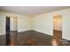 The living room boasts gleaming hardwood floors and provides a glimpse into other rooms at 923 Yuma St, Charlotte, NC 28213