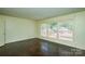 Bright living room featuring hardwood floors and large windows with plenty of natural light at 923 Yuma St, Charlotte, NC 28213