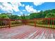 The wooden deck looks out to a green yard at 923 Yuma St, Charlotte, NC 28213