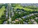 Aerial view of a residential neighborhood with tree-lined streets and a golf course at 1009 Brookline Dr, Huntersville, NC 28078