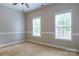 Bright bedroom with carpet, featuring two windows. Clean bedroom with natural light creates a relaxing atmosphere at 1009 Brookline Dr, Huntersville, NC 28078