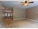Bonus room with neutral paint and carpeted floor, plus multiple windows and ceiling fan with light at 1009 Brookline Dr, Huntersville, NC 28078