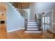 Elegant foyer with hardwood floors and a staircase with wrought iron railings at 1009 Brookline Dr, Huntersville, NC 28078