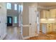 Foyer with high ceilings, hardwood flooring, an ornate door, and views of the kitchen at 1009 Brookline Dr, Huntersville, NC 28078