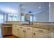Kitchen with granite countertops, stainless steel appliances, undermount sink, and eat-at counter at 1009 Brookline Dr, Huntersville, NC 28078
