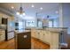 Modern kitchen with granite countertops, stainless steel appliances, and a center island at 1009 Brookline Dr, Huntersville, NC 28078
