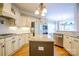 Well-appointed kitchen with stainless appliances, granite countertops and a center island at 1009 Brookline Dr, Huntersville, NC 28078