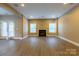 Open basement living area with wood floors, a fireplace, recessed lighting, and glass doors to the outdoors at 1009 Brookline Dr, Huntersville, NC 28078