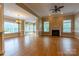 Spacious living room featuring hardwood floors, fireplace and natural light at 1009 Brookline Dr, Huntersville, NC 28078