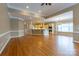 Open-concept living space with hardwood flooring and an eat-at counter overlooking the kitchen at 1009 Brookline Dr, Huntersville, NC 28078