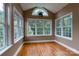 Cozy sunroom with hardwood floors and large windows at 1009 Brookline Dr, Huntersville, NC 28078