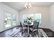 Dining room featuring a round table with 4 chairs, french doors, and large windows for natural light at 10112 Andres Duany Dr, Huntersville, NC 28078