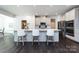 Kitchen featuring a large island with counter seating and stainless steel appliances at 10112 Andres Duany Dr, Huntersville, NC 28078