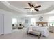 This main bedroom suite features a seating area, trey ceiling with fan, and large windows at 10112 Andres Duany Dr, Huntersville, NC 28078