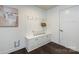 Mudroom with a bench and storage, coat hooks, and dark hardwood floors at 10112 Andres Duany Dr, Huntersville, NC 28078