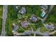 Aerial view of a residential property at 103 Samuel Guilford Ct featuring a large lot surrounded by mature trees at 103 Samuel Guilford Ct, Charlotte, NC 28270