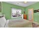 Comfortable bedroom with large window offers natural light and a pleasant view of the landscaped backyard at 103 Samuel Guilford Ct, Charlotte, NC 28270
