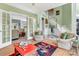 Inviting living area with hardwood floors, neutral décor, and French doors leading to additional spaces at 103 Samuel Guilford Ct, Charlotte, NC 28270