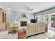 Comfortable living room with a fireplace, plush seating, and a view of the outdoor patio at 103 Samuel Guilford Ct, Charlotte, NC 28270