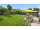 This backyard features a picnic table and umbrella for relaxing on a spacious lawn at 114 Nevis Ln, Mooresville, NC 28115