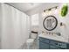 Charming bathroom with shiplap walls, modern vanity, and decorative tile flooring at 114 Nevis Ln, Mooresville, NC 28115