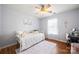 Bright bedroom with a white daybed, a soft rug, and a view of the outdoors through the window at 114 Nevis Ln, Mooresville, NC 28115