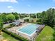 Aerial view of the community pool, playground, and surrounding neighborhood at 114 Nevis Ln, Mooresville, NC 28115