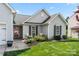 Charming single-story home featuring a well-manicured lawn and a welcoming front porch area at 114 Nevis Ln, Mooresville, NC 28115