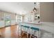 Spacious open-concept kitchen featuring modern appliances, ample counter space, and a breakfast bar with seating at 114 Nevis Ln, Mooresville, NC 28115
