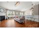 Bright living space with a fireplace, eat-in kitchen area, and a comfortable gray sofa at 114 Nevis Ln, Mooresville, NC 28115