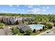 Beautiful aerial view of a swimming pool and clubhouse nestled in a lush residential community at 11530 Costigan Ln, Charlotte, NC 28277