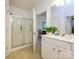 Bright bathroom with white cabinetry and a glass-enclosed shower at 11530 Costigan Ln, Charlotte, NC 28277