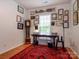 Home office featuring hardwood floors, large desk, and window with natural light at 11530 Costigan Ln, Charlotte, NC 28277