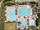 Aerial view showing pools with lounge seating, umbrellas and recreational water features in this residential community at 11909 Cupworth Ct, Huntersville, NC 28078
